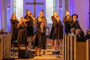 Church worship team leading a service broadcast by livestream and phone