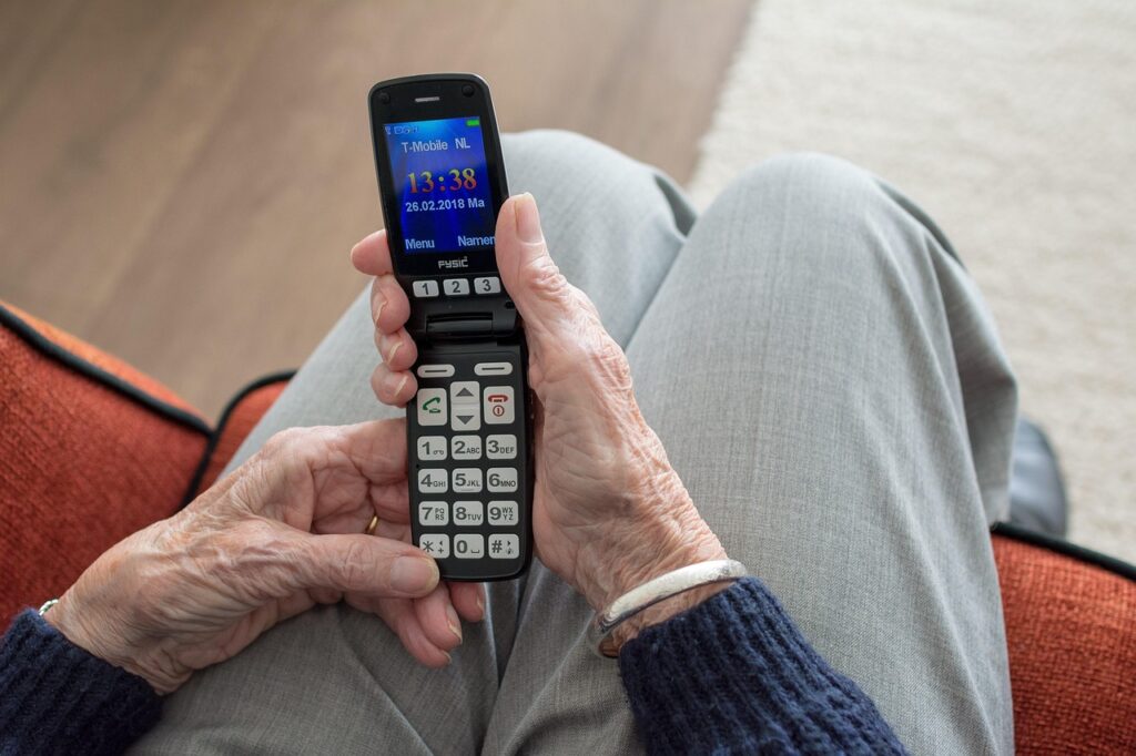 Homebound member dialing in to a church service on a cordless phone