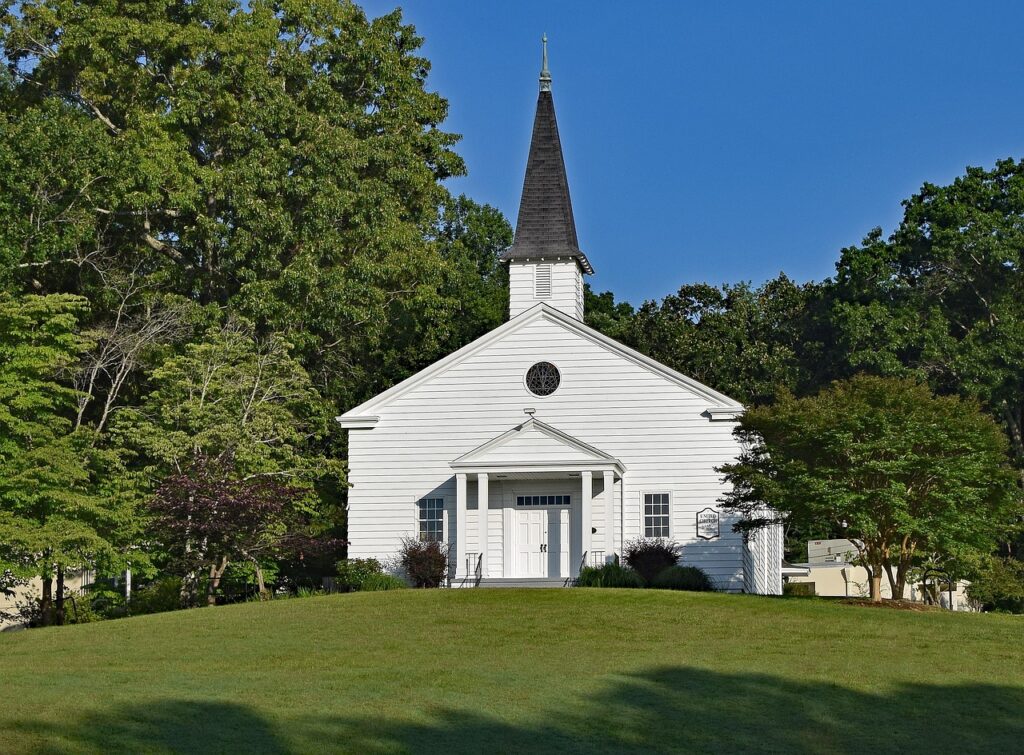 Small white country church that offers a dial-in phone line